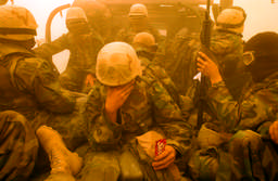 A Marine clung onto a packet of Skittles during a sandstorm in the southern Iraqi desert